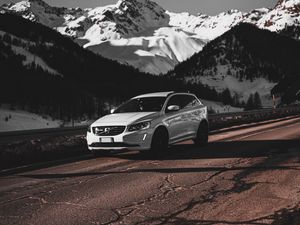 Preview wallpaper car, white, road, mountains, snow