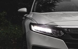 Preview wallpaper car, white, wet, headlight, light, front view