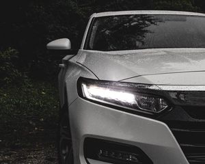 Preview wallpaper car, white, wet, headlight, light, front view