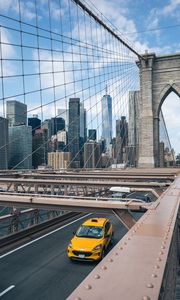 Preview wallpaper car, yellow, bridge, city, buildings