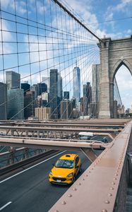 Preview wallpaper car, yellow, bridge, city, buildings