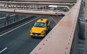 Preview wallpaper car, yellow, bridge, city, buildings