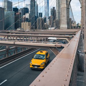 Preview wallpaper car, yellow, bridge, city, buildings