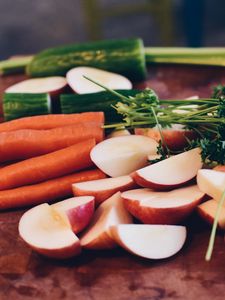 Preview wallpaper carrots, vegetables, parsley, cucumber, broccoli, apples, cutting board