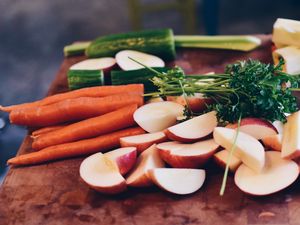 Preview wallpaper carrots, vegetables, parsley, cucumber, broccoli, apples, cutting board