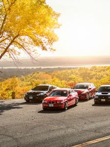 Preview wallpaper cars, asphalt, trees, parking