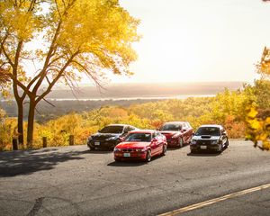 Preview wallpaper cars, asphalt, trees, parking