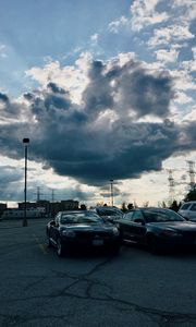 Preview wallpaper cars, city, evening, clouds