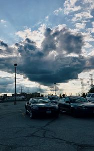 Preview wallpaper cars, city, evening, clouds