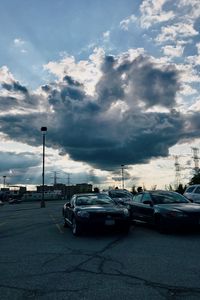 Preview wallpaper cars, city, evening, clouds