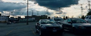 Preview wallpaper cars, city, evening, clouds