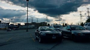 Preview wallpaper cars, city, evening, clouds