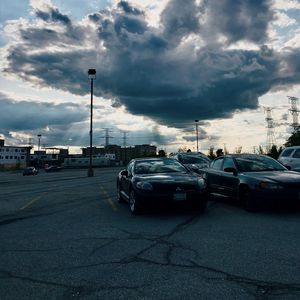 Preview wallpaper cars, city, evening, clouds