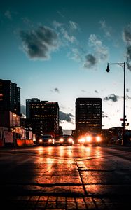 Preview wallpaper cars, headlights, light, road, buildings, twilight