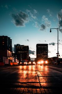 Preview wallpaper cars, headlights, light, road, buildings, twilight