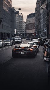 Preview wallpaper cars, road, back view, city, street