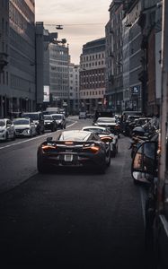 Preview wallpaper cars, road, back view, city, street