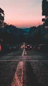 Preview wallpaper cars, road, dusk, city