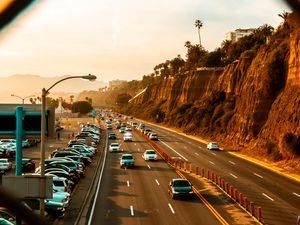 Preview wallpaper cars, road, parking, rocks, fence