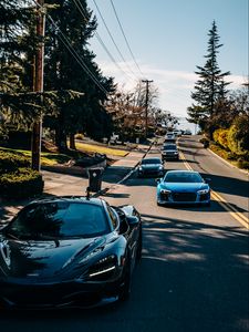 Preview wallpaper cars, road, speed, trees