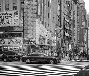 Preview wallpaper cars, street, city, buildings, bw