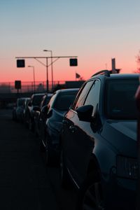 Preview wallpaper cars, sunset, traffic, sky