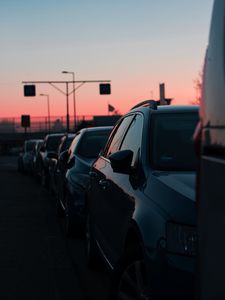 Preview wallpaper cars, sunset, traffic, sky