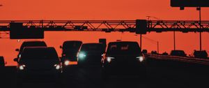 Preview wallpaper cars, transportation, sunset, headlights