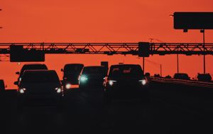 Preview wallpaper cars, transportation, sunset, headlights