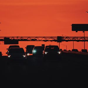 Preview wallpaper cars, transportation, sunset, headlights