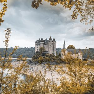 Preview wallpaper castle, branches, leaves, lake, architecture