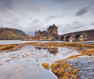 Preview wallpaper castle, bridge, arches, stone, water, lake, stones, vegetation, cold, emptiness, loneliness, terribly