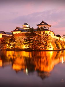 Preview wallpaper castle, building, glow, water, reflection, twilight