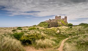 Preview wallpaper castle, building, grass, path, sky