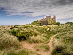 Preview wallpaper castle, building, grass, path, sky