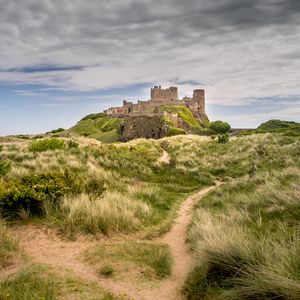 Preview wallpaper castle, building, grass, path, sky