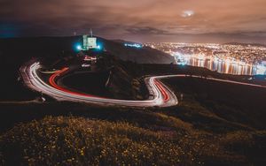 Preview wallpaper castle, building, hills, long exposure, light, night