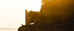 Preview wallpaper castle, coast, cliffs, sea, sunset