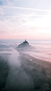 Preview wallpaper castle, island, hill, fog, aerial view