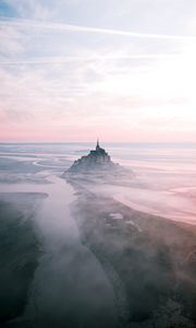 Preview wallpaper castle, island, hill, fog, aerial view