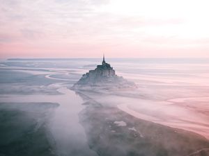 Preview wallpaper castle, island, hill, fog, aerial view