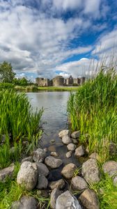 Preview wallpaper castle, lake, stones, grass