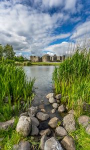 Preview wallpaper castle, lake, stones, grass