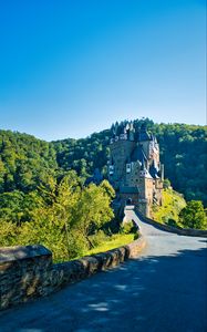 Preview wallpaper castle, road, forest, trees, sky