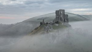 Preview wallpaper castle, ruins, mountain, fog