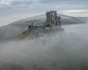 Preview wallpaper castle, ruins, mountain, fog