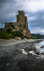 Preview wallpaper castle, ruins, shore, pebbles, sea
