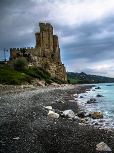 Preview wallpaper castle, ruins, shore, pebbles, sea