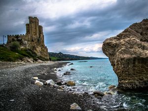 Preview wallpaper castle, ruins, shore, pebbles, sea