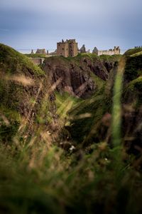 Preview wallpaper castle, slope, cliff, building, grass